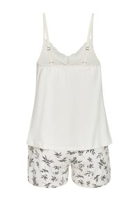 Witte cami met kantafwerking, gecombineerd met beige shorts met een zwart bladerenpatroon. Zachte stof, verstelbare bandjes op het topje.