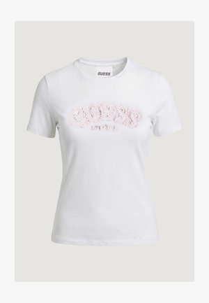Weißes T-Shirt mit kurzen Ärmeln und Rundhalsausschnitt, verziert mit dem "GUESS"-Logo in pinken Pailletten auf der Brust.