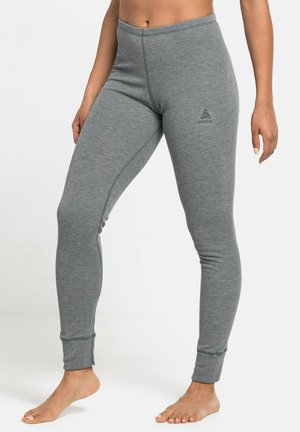 Gray leggings in fitted design, made from soft material, featuring a ribbed texture, narrow ankle cuffs, and a small logo detail on the hip.