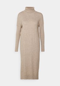 Robe col roulé beige en matière tricotée douce. Comprend des manches longues, une silhouette droite et des poignets côtelés aux poignets et à l'ourlet.