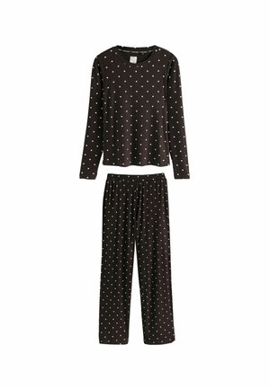 Brun ribbet pyjamasæt med langærmet top og bukser, begge med hvide prikker. Blødt stof, afslappet pasform, elastisk talje.
