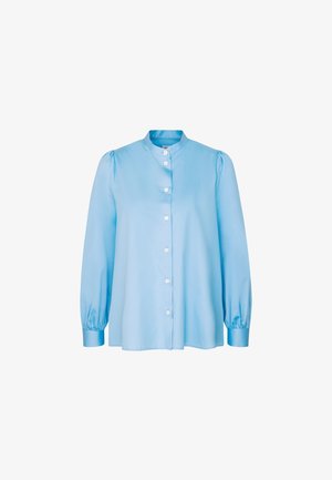 Light blue long-sleeve blouse with a round collar, button-front closure, and puffed sleeves. Made of smooth fabric with a loose fit.