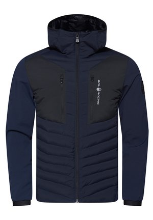 Chaqueta acolchada de color navy con paneles negros, bolsillos en el pecho con cremallera, cuello alto y puños elásticos. Presenta un cierre central con cremallera.