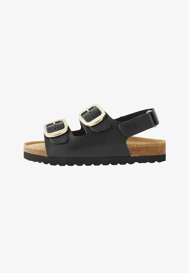 Sandal nero con due fibbie argentate, soffice in sughero e suola in gomma testurizzata. Dotato di cinturino posteriore regolabile per una vestibilità sicura.