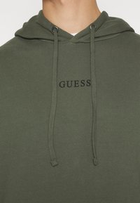 Guess ROY  - Jersey con capucha - clean fatigue