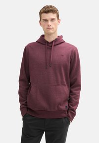 Bordeaux hoodie met een kangoeroezak, verstelbare capuchon en geribde manchetten. Gemaakt van zachte stof en heeft een klein logo op de borst.