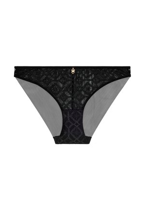 Tanga en dentelle noire avec côtés en mesh gris transparent, présentant un motif géométrique à l'avant et un emblème doré au centre. Tissu texturé.
