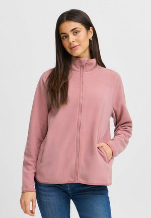 Veste polaire de couleur rose douce, avec un col montant, fermeture éclair complète et poches latérales. Texture lisse avec des manches longues et une coupe confortable.