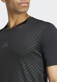 adidas Performance POWER WORKOUT - Sports T-shirt - black carbon