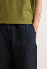 Carhartt WIP JUDD PANT - Trousers - black stone dyed