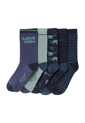 Five pairs of children's socks in blue and green tones, featuring dinosaur patterns, stripes, and "Super Dino" text on plain white background.