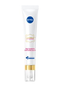 Trattamento per gli occhi NIVEA in un tubo bianco con dettagli dorati. Presenta un logo esagonale e la scritta "TRATTAMENTO CONTORNO OCCHI" in testo rosa. Punta applicatrice trasparente.