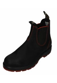 Black ankle boot with elastic side panels, red stitching, and a textured sole. Features a pull tab for easy wear and a durable material finish.