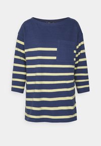 T-shirt às riscas azul-marinho e amarela com decote arredondado, mangas de três quartos e um bolso frontal. Feita de um tecido suave.