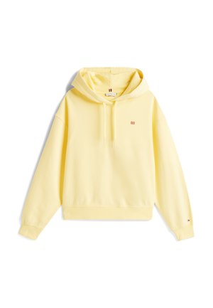 Sudadera amarilla con capucha, hecha de algodón suave. Cuenta con un bolsillo frontal, puños acanalados y un pequeño logo en el pecho. Corte casual.