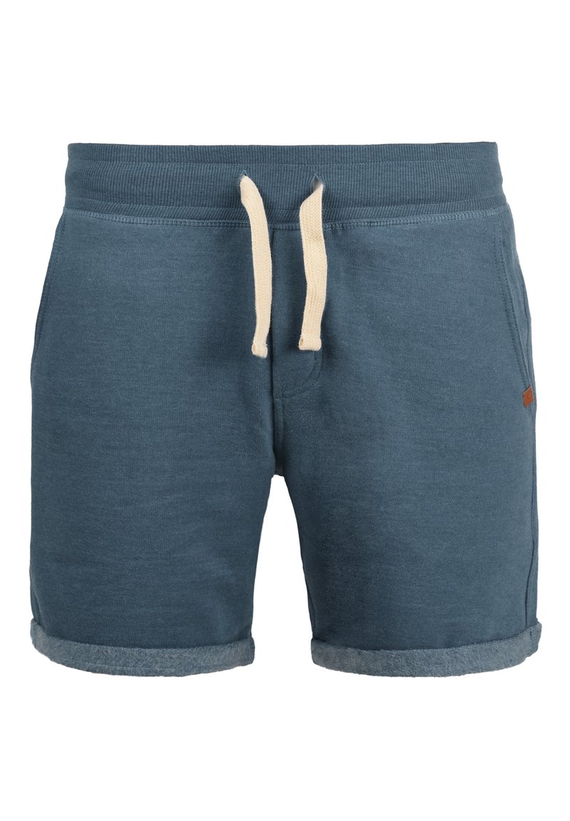 Blue cotton blend shorts with an elastic waistband, cream drawstring, and rolled hem. Features side pockets and small brand tag on the side.