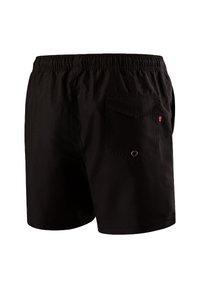 Pantaloni corti neri con un elastico in vita, dotati di una tasca posteriore e un piccolo logo rosso. Tessuto morbido con un taglio classico.