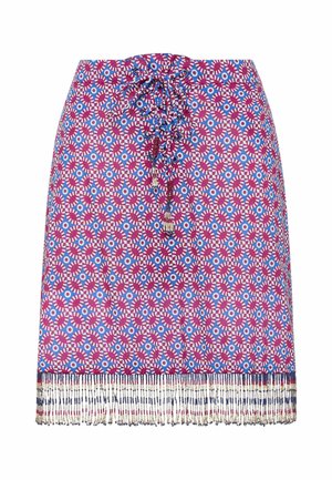 Jupe avec motif géométrique rouge et bleu, détail lacé à l'avant et frange perlée multicolore le long de l'ourlet.