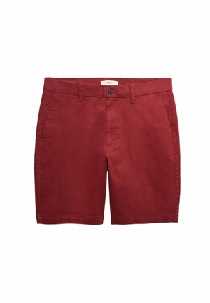 Czerwone bawełniane szorty z płaskim przodem, dwoma bocznymi kieszeniami i zapięciem na guzik. Gładka faktura i dopasowany krój.