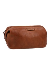 Brown leather toiletry bag with a rectangular shape, zipper closure, subtle texture, and embossed label on the front.