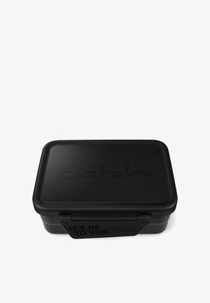 Black rectangular lunchbox with rounded edges, composed of matte material. Features embossed "Satch" logo and a latch with "IT'S UP TO YOU" text.