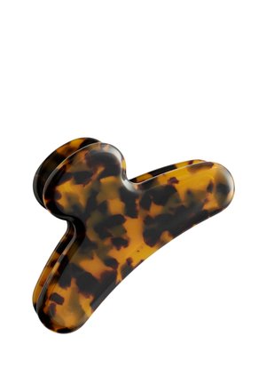 Hårklemme i plastik med skildpadde-kamarmønster, brede buede arme og fjederled til at fastholde håret.