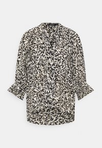 Leichte Bluse mit einem schwarz-weißen abstrakten Muster, kragenlosem Design und Dreiviertelärmeln mit Rüschensäumen.