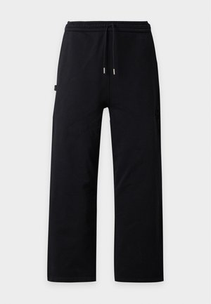 Han Kjøbenhavn, EMBOSSED DIAMOND - Долнище на анцуг - faded black