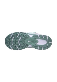 Sole di scarpa da corsa Nike in materiale gommoso, con una combinazione di colori verde e bianco, superficie testurizzata e scanalature flessibili per una buona aderenza.