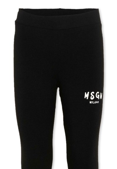 Leggings à taille élastique noire avec le logo blanc "MSGM Milano" imprimé sur la cuisse supérieure.