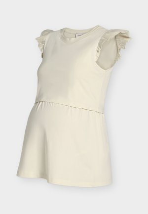 Mouwloze zwangerschaps top in crèmekleur met gerimpelde schouderdetails en een geplooide taille.