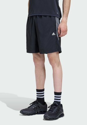 LIGHTWEIGHT REGULAR - Tracksuit bottoms - black