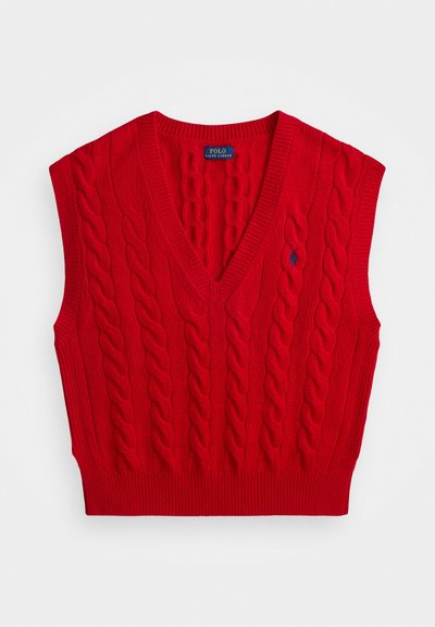 Punane kabeli-kootud varrukateta sviiter V-kaelusega, ribitud äärtega ja väike sinine logo vasakul küljel. Valmistatud tekstuursetest lõngadest.