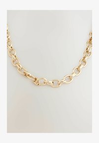 Seleccionado, gold tone