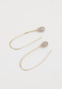 Gold-tone earrings with elongated hooks, featuring teardrop-shaped ends encrusted with clear crystals, creating a textured look.