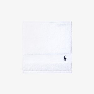 White cotton towel featuring a textured surface, two horizontal bands, and a black embroidered logo of a horseman at the bottom corner.