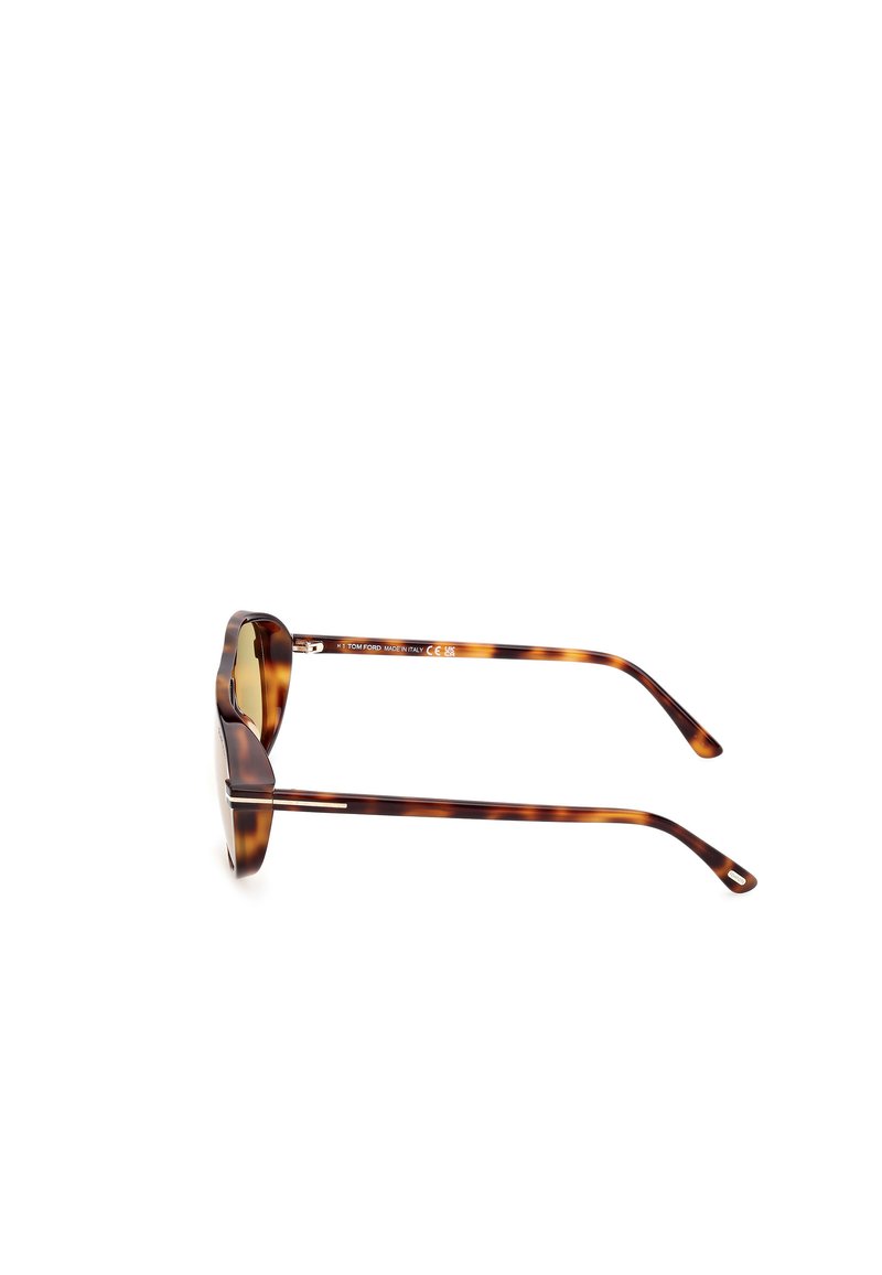 Occhiali da sole tartarugati con montatura tondeggiante, stanghette eleganti e un motivo sottile. Realizzati in plastica, con lenti di colore verde.