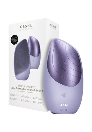 Brosse faciale thermo sonique 6 en 1 Geske violette avec surface de nettoyage texturée, fonction chauffante et emballage présentant les détails du produit.