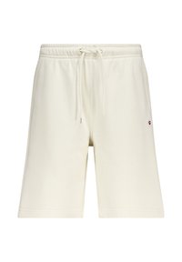 Shorts deportivos de color crema, hechos de una suave mezcla de algodón. Cuentan con una cinturilla elástica con cordón y terminan a medio muslo.