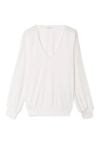 Top bianco a maniche lunghe con scollo a V e dettagli in pizzo lungo le spalle. Presenta polsini elasticizzati e una vestibilità rilassata. Tessuto di morbida consistenza.