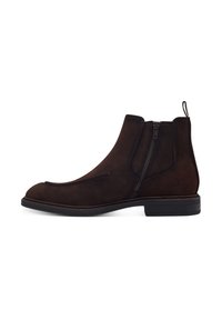 Bottines en daim marron avec fermetures éclair latérales, bout rond et petit talon empilé. Présentent une couture contrastante et une languette à l'arrière.