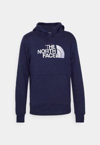 Felpa navy con tasca frontale, cappuccio con coulisse e design del logo bianco "The North Face" sul petto. Tessuto in misto cotone.