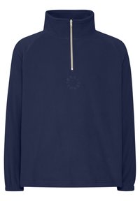Pull en polaire bleu marine avec un col haut et une fermeture éclair quart de longueur, présentant un logo discret imprimé sur la poitrine et des poignets élastiqués.