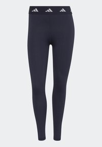 Leggings atletici blu navy con un design aderente, vita elastica con tre strisce grigie e una superficie opaca liscia.