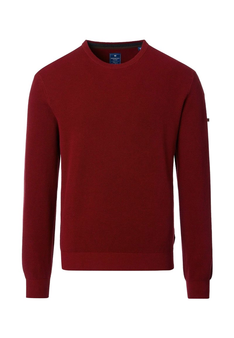 Roter gestrickter Pullover mit rundem Ausschnitt, strukturiertem Muster und gerippten Bündchen. Mit seitlichen Schlitzen für mehr Bewegungsfreiheit, ausgestattet mit einem dezenten Logo auf dem Ärmel.
