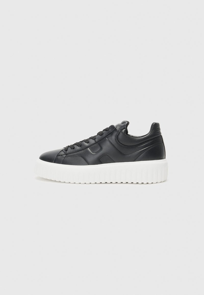 Black leather sneakers with a thick white sole, featuring round toe, lace-up design, textured side accents, and smooth finish.