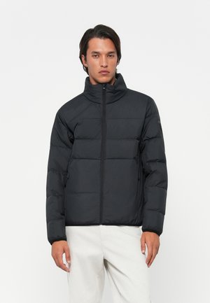 Black puffer jacket with a high collar, quilted design, and zip front. Features elastic cuffs and two side pockets for functionality.