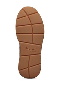 Rubber shoe sole with a textured, gripped surface. Features a tan color and patterned grooves. "Voile Blanche" logo printed near the heel.