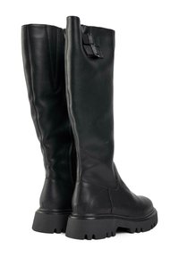 Black leather knee-high boots with a smooth texture, chunky treaded sole, and a side zipper. Includes a decorative strap detail at the top.