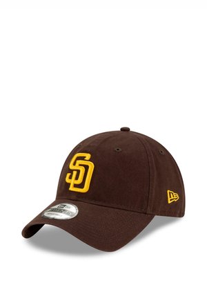 Brown adjustable baseball cap with yellow "SD" logo on front and yellow New Era logo on side, placed on white background.